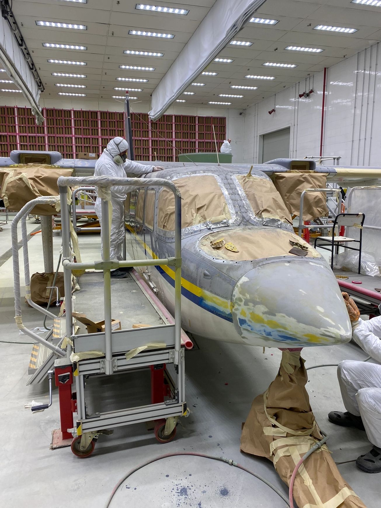 Aviatoria technicians working on an aircraft in the hangar