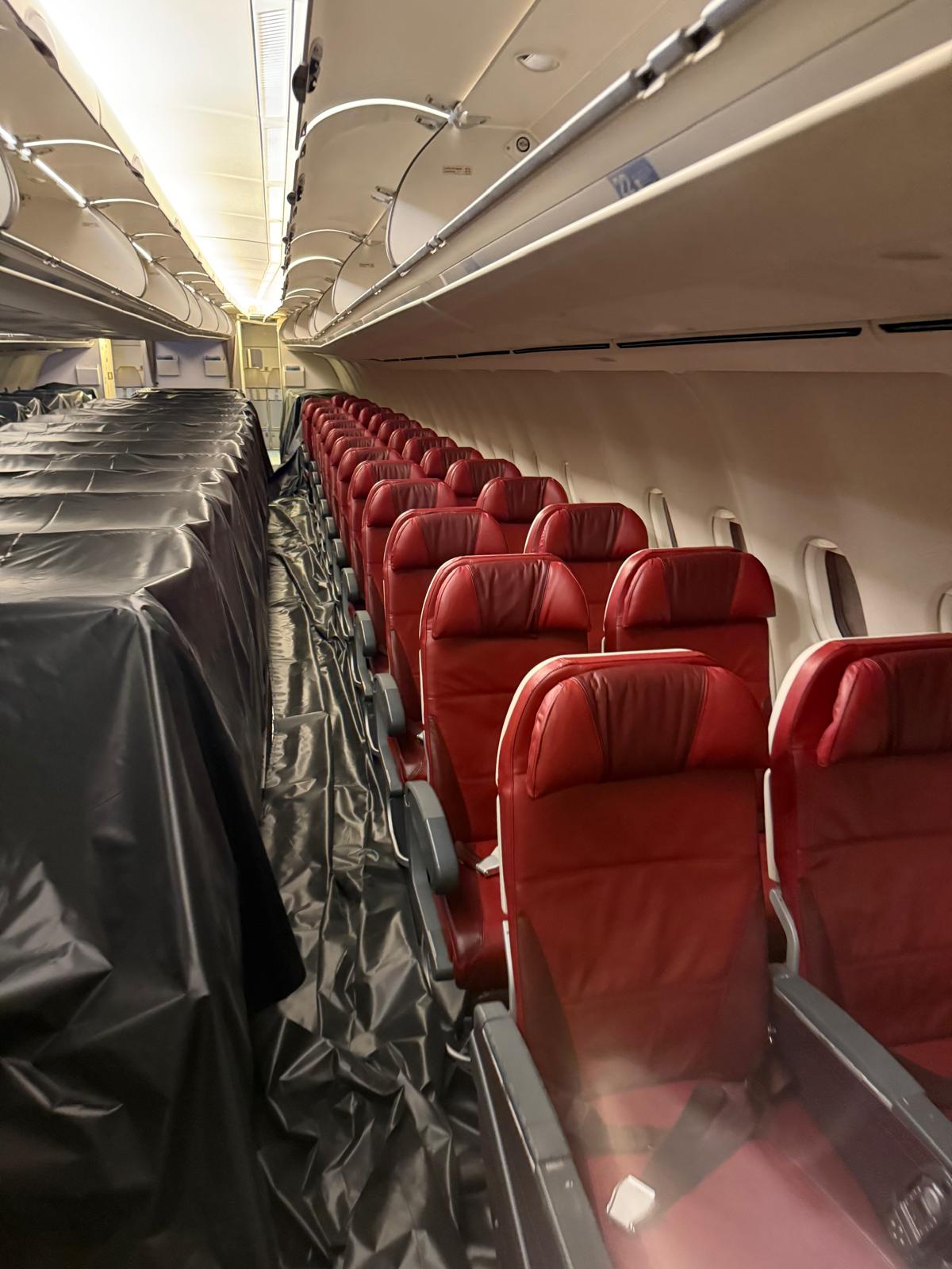Cabin retrofit with new seats being installed